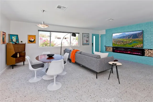 a bathroom with a sink mirror and vanity