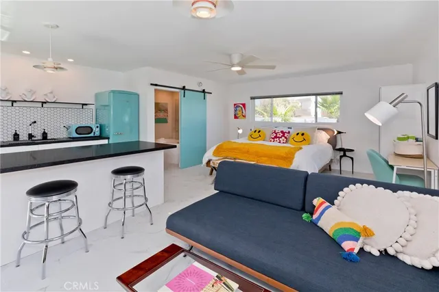 a view of a room with painted walls and a window