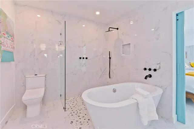 a backyard of a house with outdoor seating