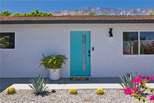 a view of a backyard with sitting area