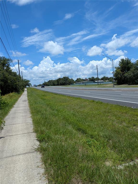 6041 County Line Road Spring Hill, FL 34606 - Photo 3 of 7 a view of a lake with a big yard