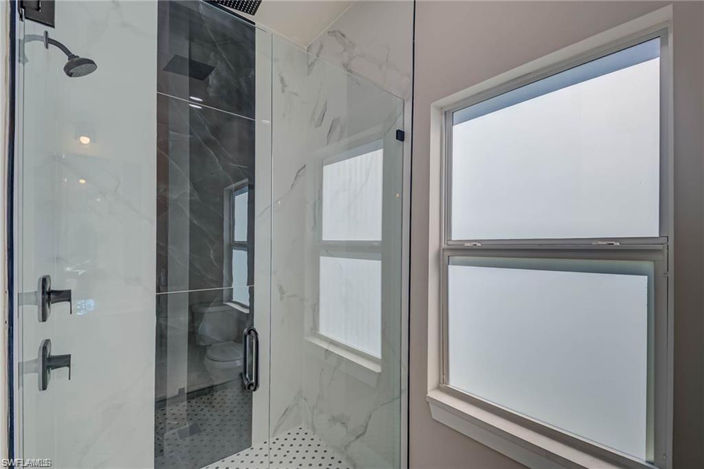 2023 Robert Avenue Alva, FL 33920 - Photo 4 of 8 Bathroom with plenty of natural light and a marble finish shower