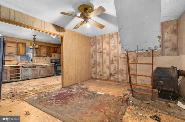 a view of a kitchen with refrigerator and cabinets