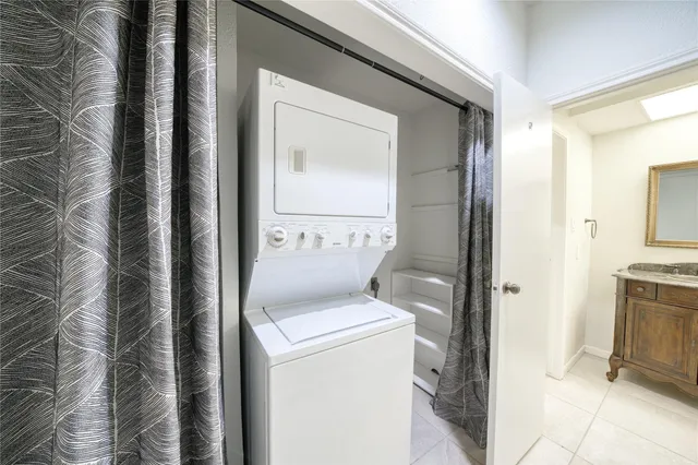 a bathroom with a granite countertop sink toilet and mirror