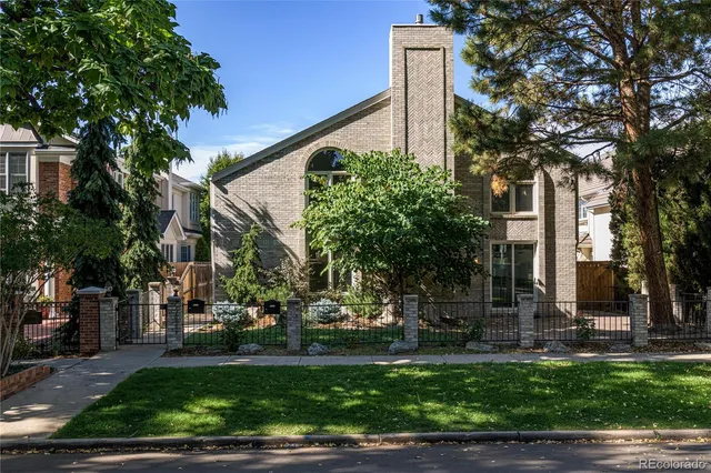 a view of a building with a yard