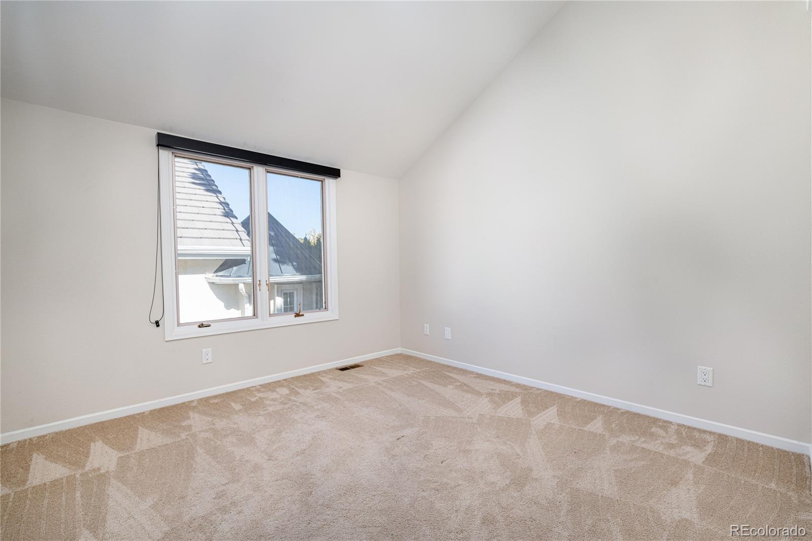 541 Monroe Street, Unit A Denver, CO 80206 - Photo 24 of 45 an empty room with a window