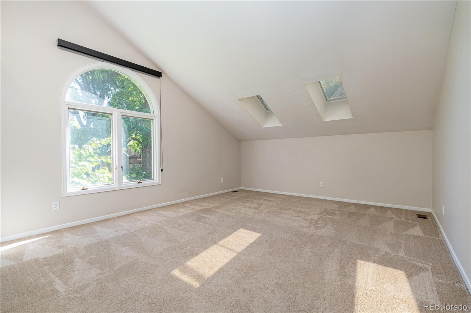 541 Monroe Street, Unit A Denver, CO 80206 - Photo 26 of 45 an empty room with a window