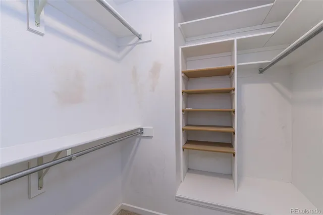 a view of an empty walk in closet