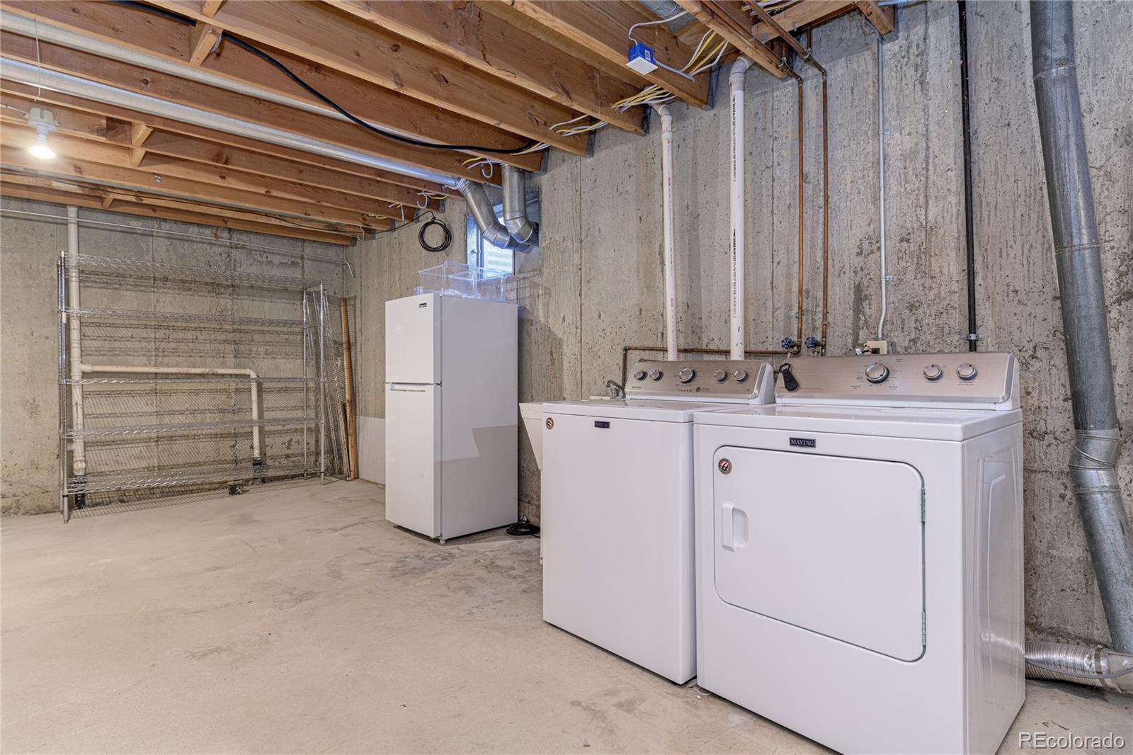 541 Monroe Street, Unit A Denver, CO 80206 - Photo 32 of 45 a utility room with dryer and washer