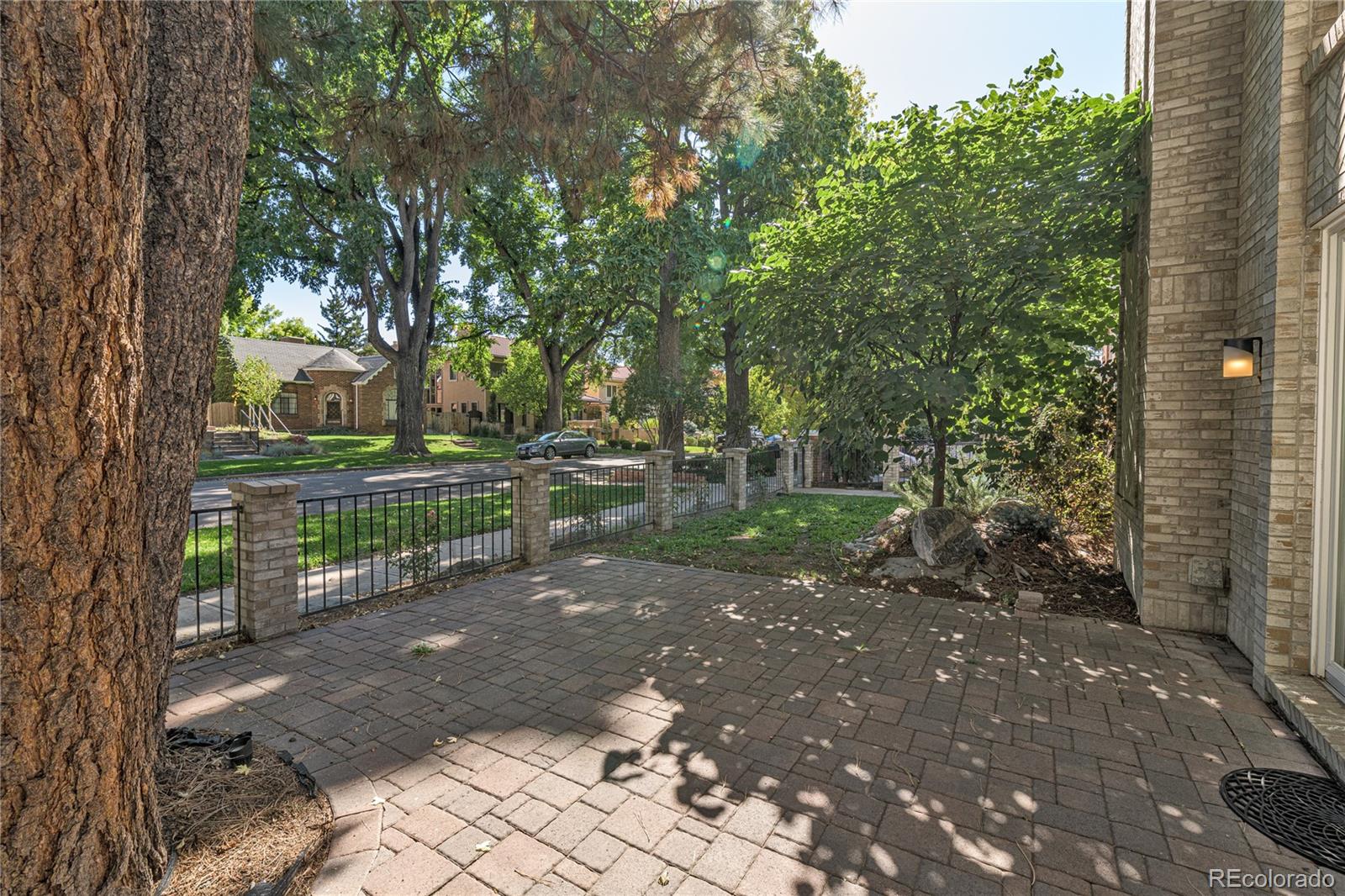 541 Monroe Street, Unit A Denver, CO 80206 - Photo 35 of 45 a view of a street with large trees