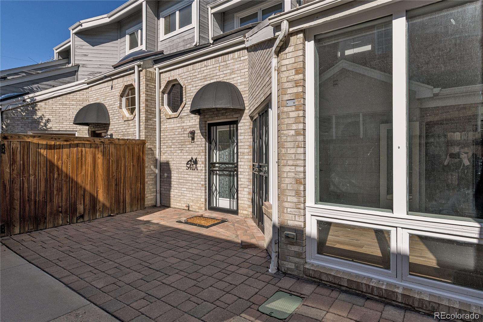 541 Monroe Street, Unit A Denver, CO 80206 - Photo 40 of 45 a front view of a house with a door