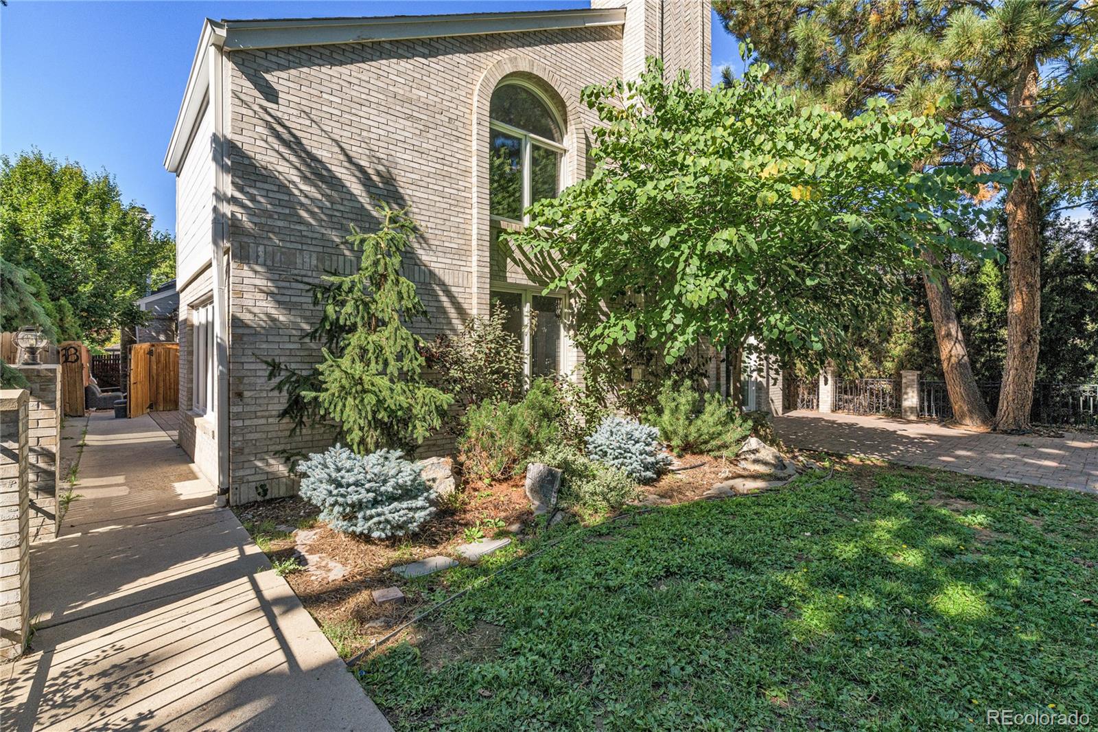541 Monroe Street, Unit A Denver, CO 80206 - Photo 41 of 45 a front view of a house with garden