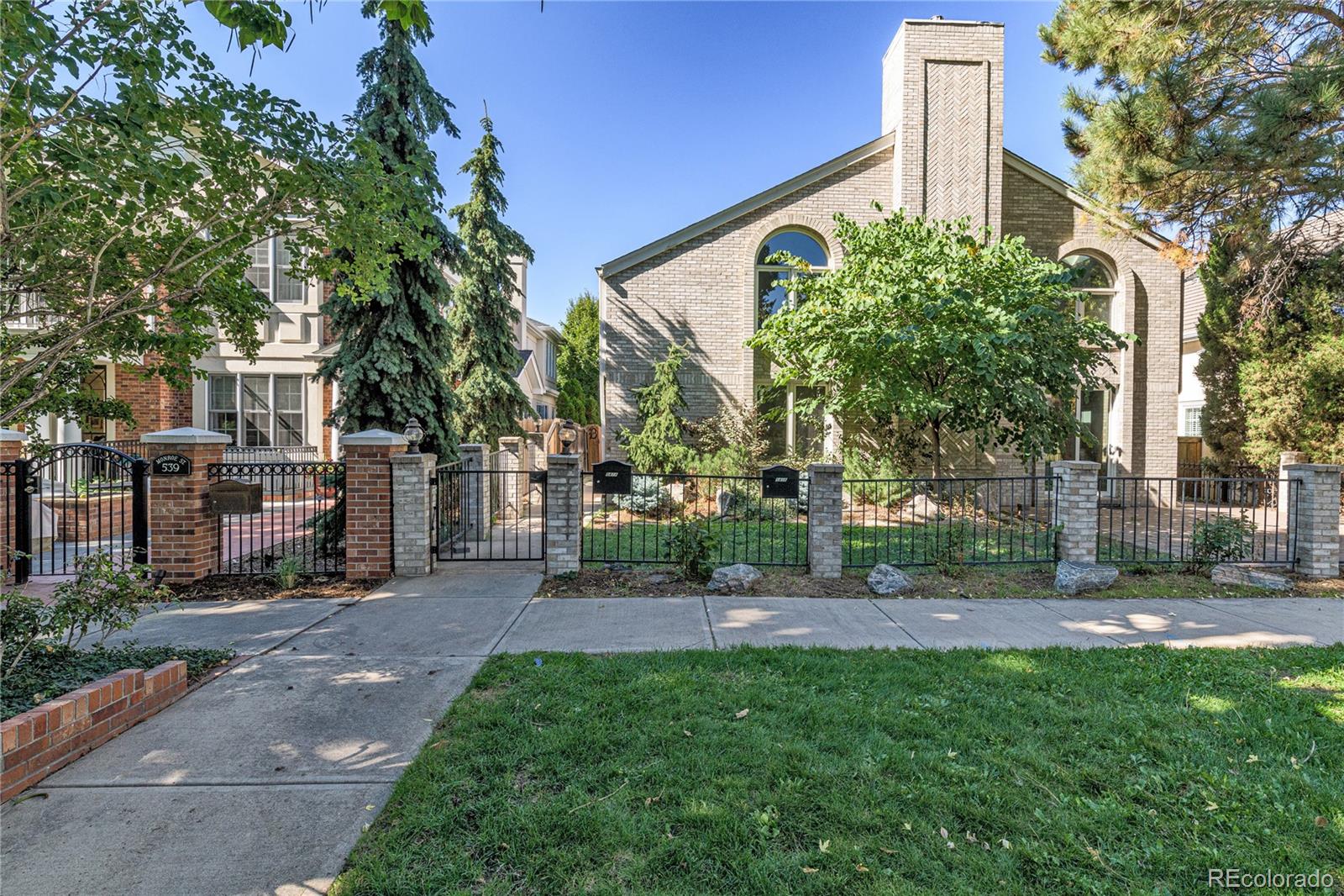 541 Monroe Street, Unit A Denver, CO 80206 - Photo 42 of 45 a view of a chair and table in the garden