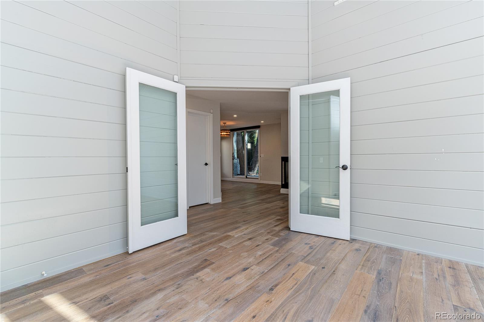 541 Monroe Street, Unit A Denver, CO 80206 - Photo 5 of 45 a view of a hallway with wooden floor