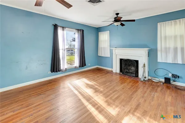 a bedroom with a bed and a fireplace