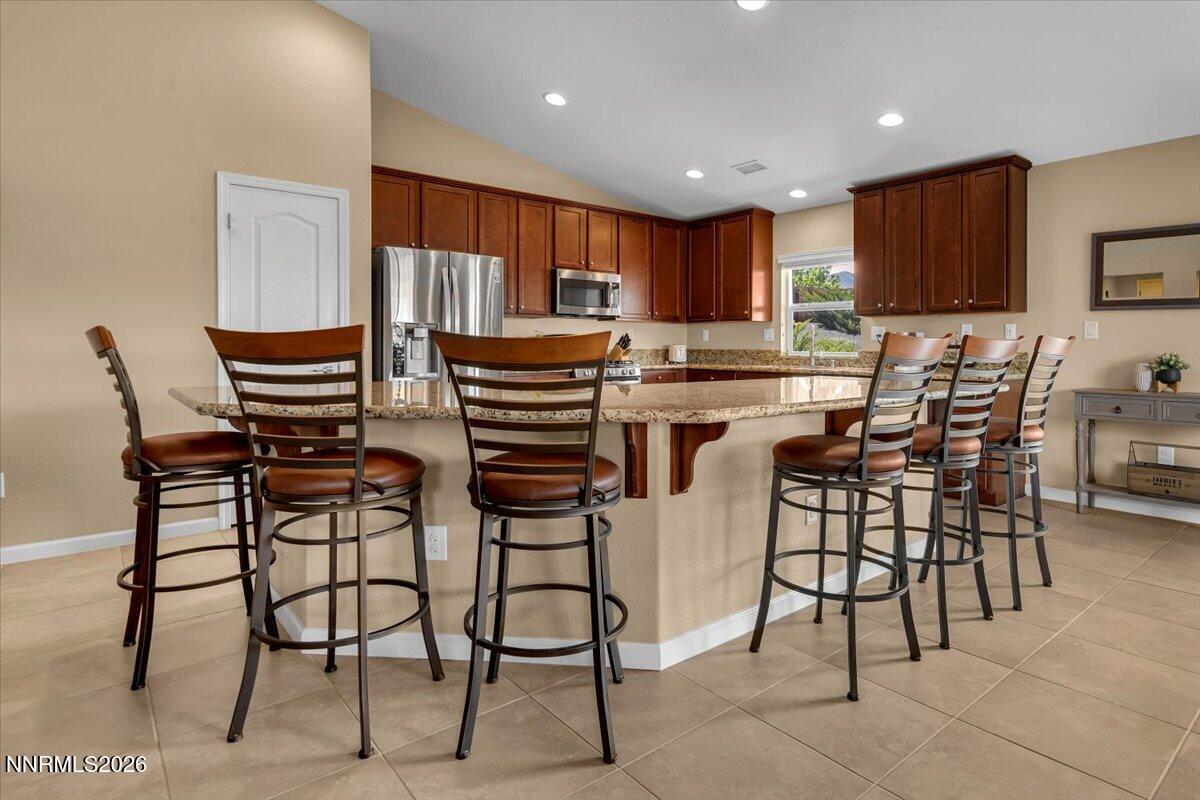 104 Bethpage Road Dayton, NV 89403 - Photo 9 of 65 a kitchen with a table and chairs in it