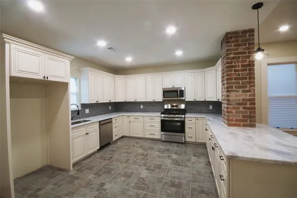 a view of kitchen and wooden floor