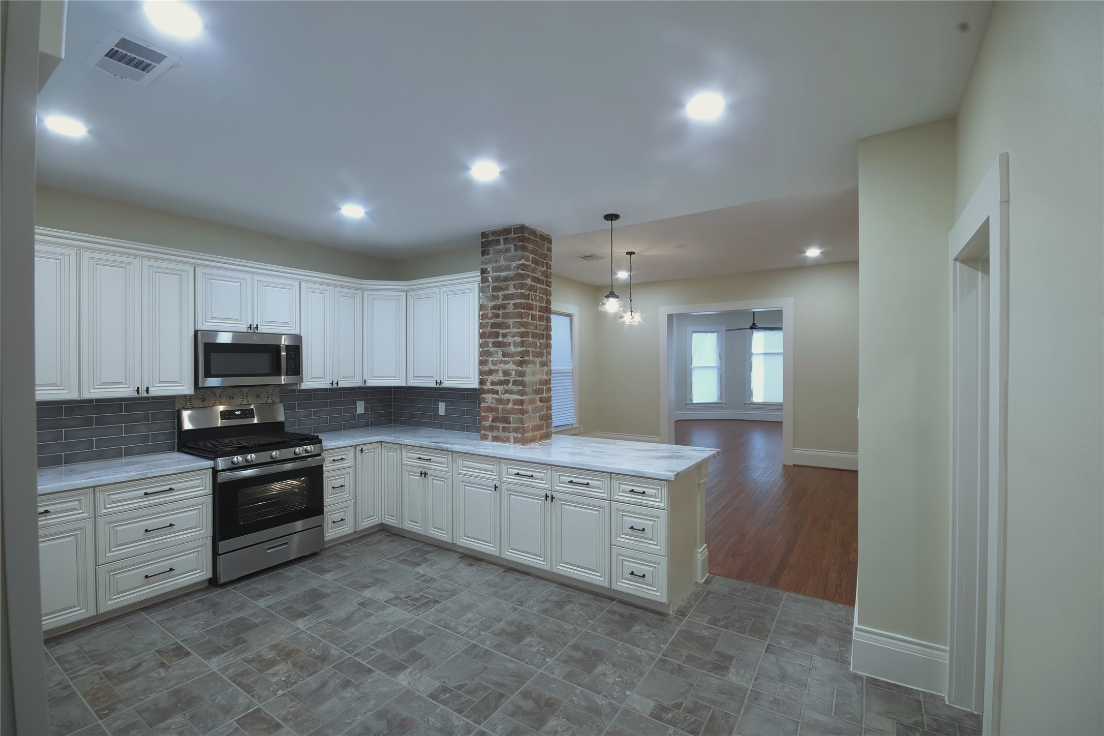 505 Winnie Street Houston, TX 77009 - Photo 15 of 29 An open concept with the cabinet extension for serving.