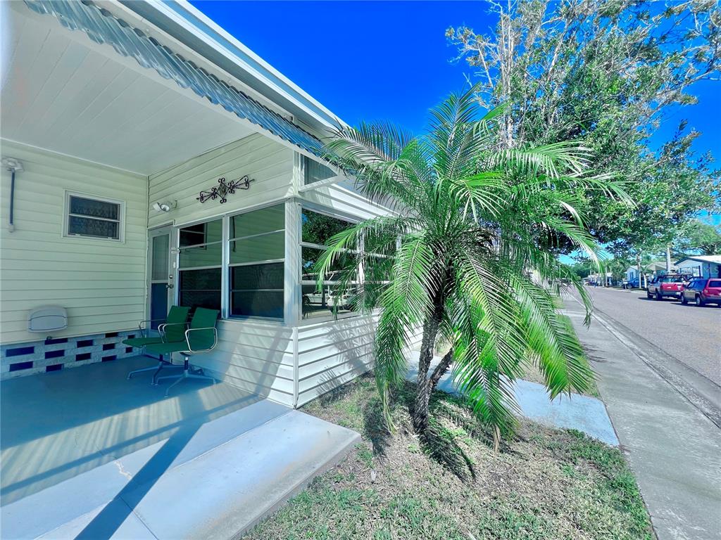 1100 South Belcher Road, Unit 719 Largo, FL 33771 - Photo 11 of 60 a view of a house with a yard