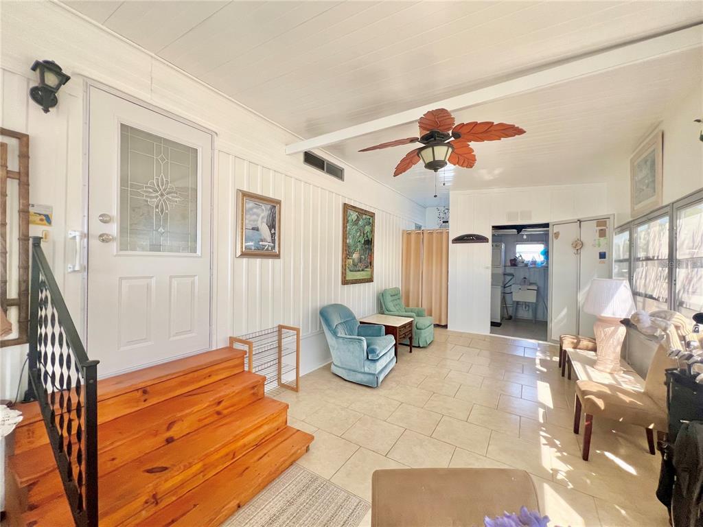 1100 South Belcher Road, Unit 719 Largo, FL 33771 - Photo 12 of 60 a bedroom with furniture and wooden floor