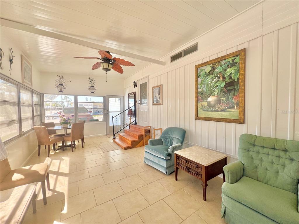 1100 South Belcher Road, Unit 719 Largo, FL 33771 - Photo 14 of 60 a living room with furniture and a large window