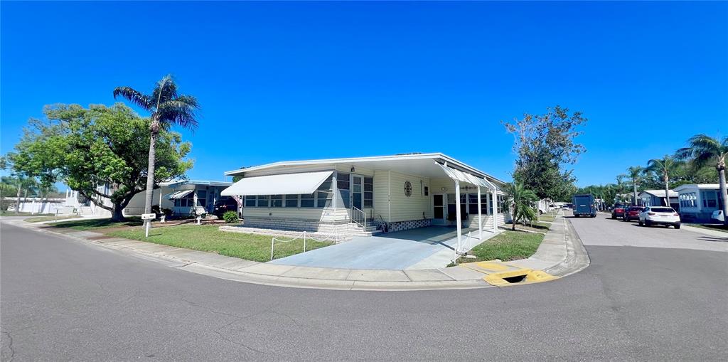 1100 South Belcher Road, Unit 719 Largo, FL 33771 - Photo 2 of 60 a view of a house with backyard and porch
