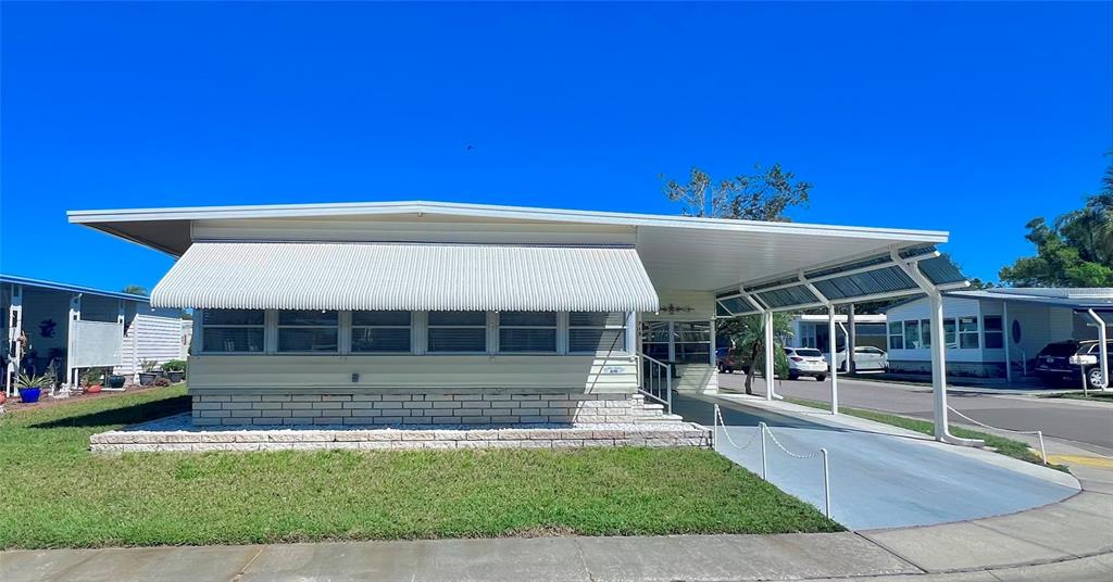 1100 South Belcher Road, Unit 719 Largo, FL 33771 - Photo 3 of 60 a view of a house with a backyard
