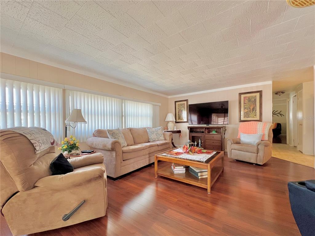 1100 South Belcher Road, Unit 719 Largo, FL 33771 - Photo 33 of 60 a living room with furniture and a flat screen tv