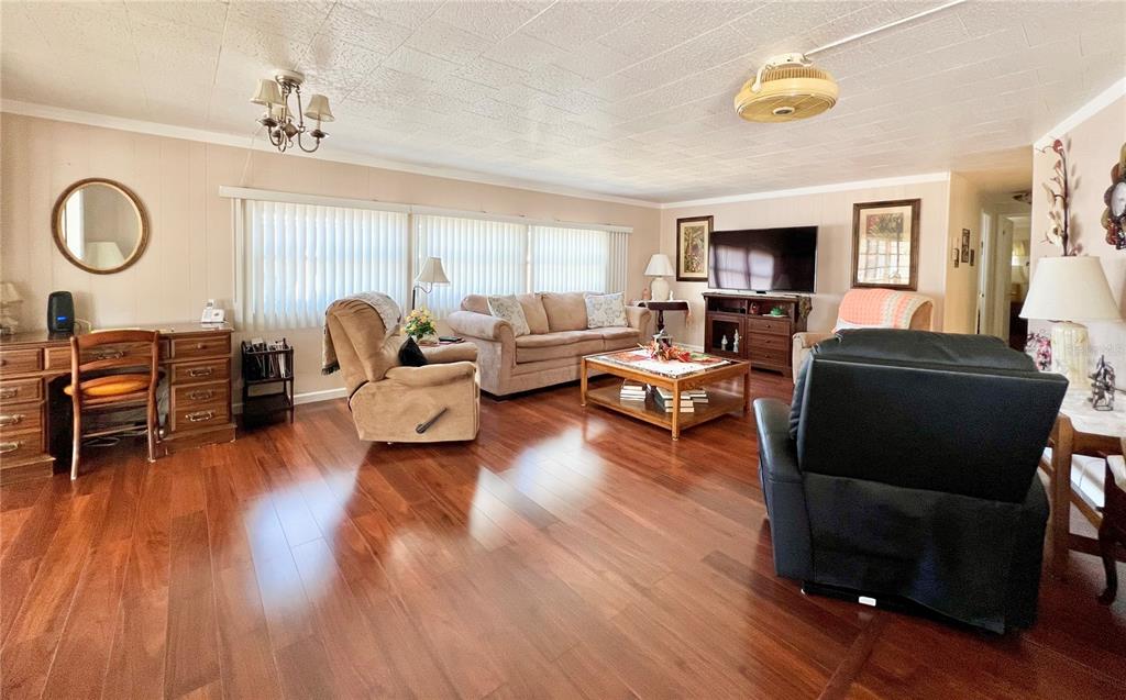 1100 South Belcher Road, Unit 719 Largo, FL 33771 - Photo 35 of 60 a living room with furniture and a flat screen tv