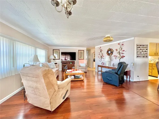 a bathroom with a granite countertop sink mirror bathtub and shower