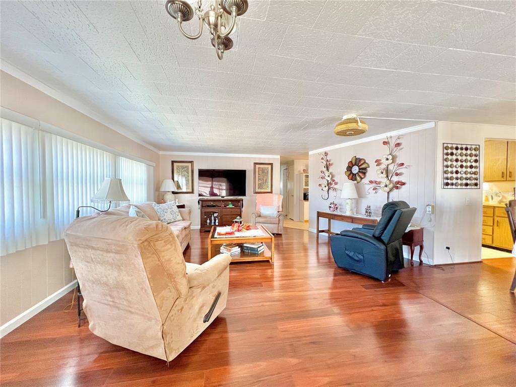 1100 South Belcher Road, Unit 719 Largo, FL 33771 - Photo 36 of 60 a living room with fireplace furniture and a flat screen tv