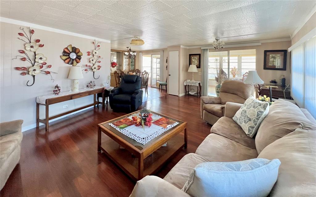 1100 South Belcher Road, Unit 719 Largo, FL 33771 - Photo 39 of 60 a living room with furniture and wooden floor