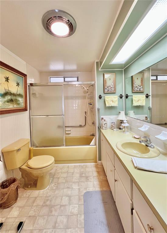 1100 South Belcher Road, Unit 719 Largo, FL 33771 - Photo 40 of 60 a bathroom with a granite countertop sink toilet mirror and bathtub