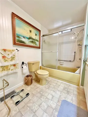 a bathroom with a shower and a toilet