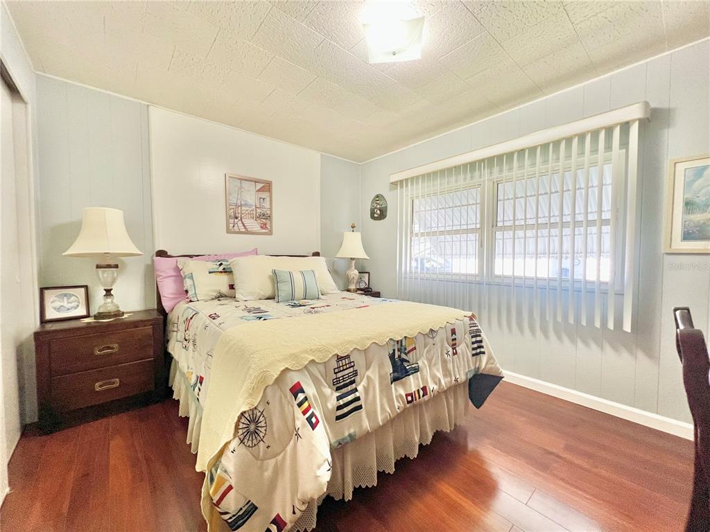 1100 South Belcher Road, Unit 719 Largo, FL 33771 - Photo 45 of 60 a bedroom with a bed and a window