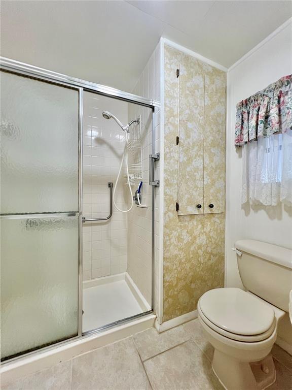 1100 South Belcher Road, Unit 719 Largo, FL 33771 - Photo 49 of 60 a bathroom with a shower and a toilet