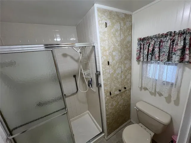 a view of a swimming pool and trees in the background