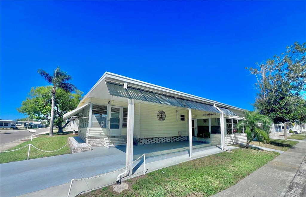 1100 South Belcher Road, Unit 719 Largo, FL 33771 - Photo 5 of 60 a view of a house with backyard porch and sitting area