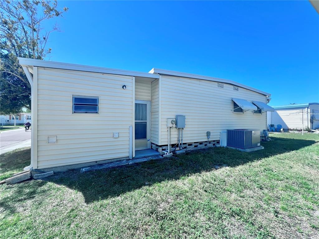 1100 South Belcher Road, Unit 719 Largo, FL 33771 - Photo 8 of 60 a view of a house with a yard
