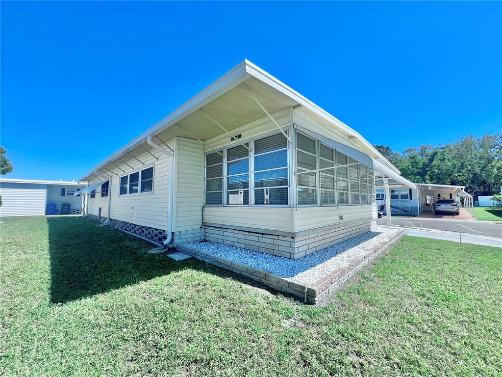 1100 South Belcher Road, Unit 719 Largo, FL 33771 - Photo 10 of 60 a house view with a garden space