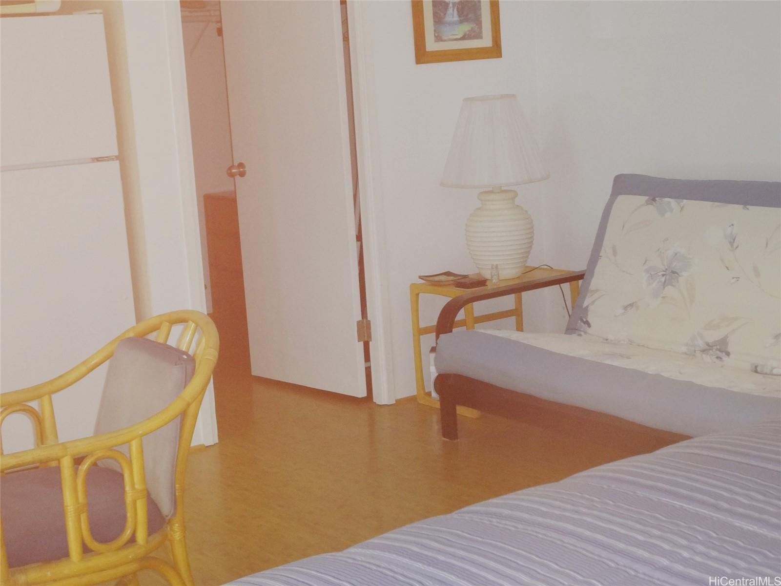 2572 Lemon Road, Unit 803 Honolulu, HI 96815 - Photo 5 of 6 a view of a room with wooden floor