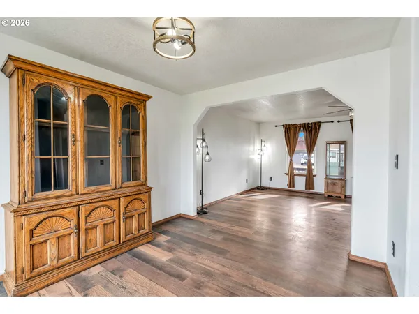 a kitchen with stainless steel appliances granite countertop a sink refrigerator and cabinets
