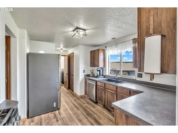 a kitchen with a sink cabinets and window