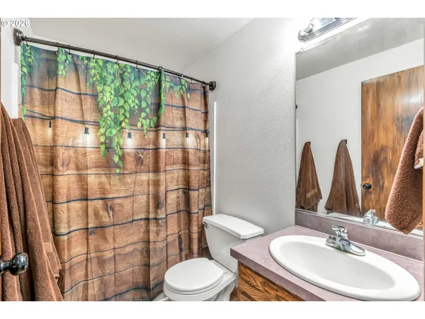 a bedroom with a bed and a book shelf