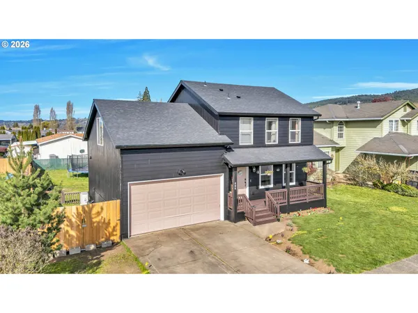 a kitchen with a table and chairs