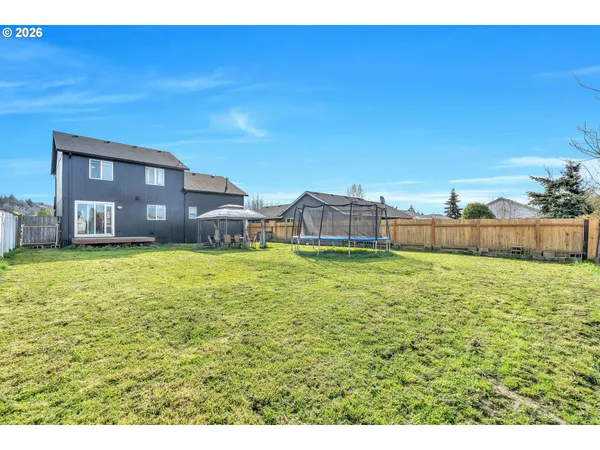a view of balcony with wooden fence