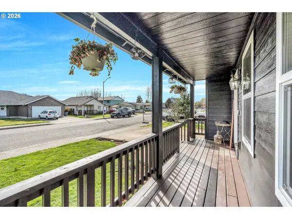 a view of balcony with wooden floor