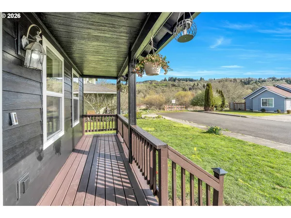 a view of balcony with wooden floor