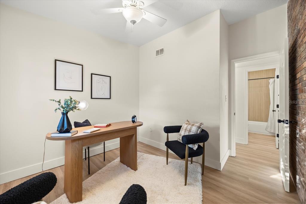 115 West Fillmore Avenue Orlando, FL 32809 - Photo 15 of 23 a living room with furniture and wooden floor