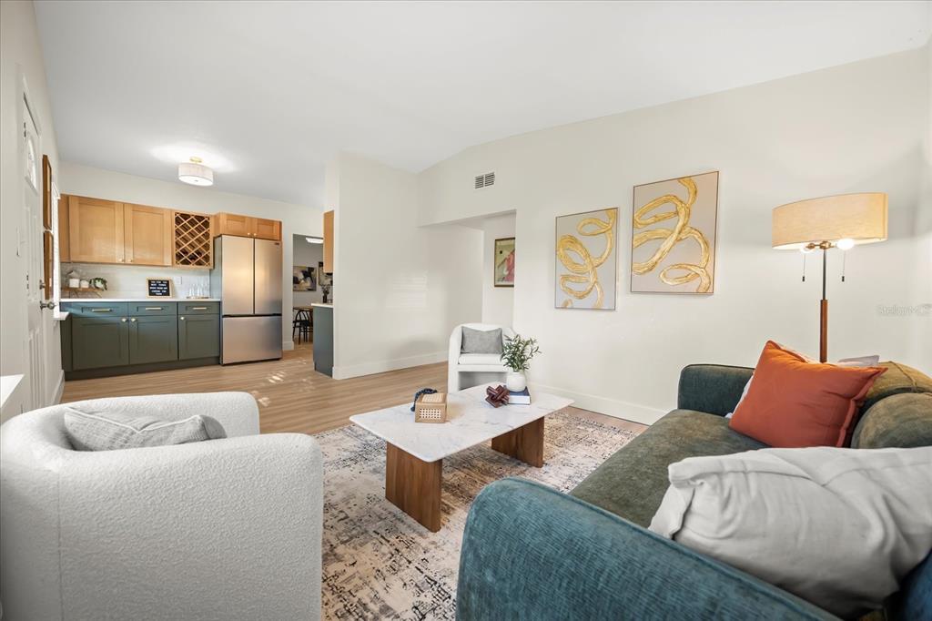 115 West Fillmore Avenue Orlando, FL 32809 - Photo 2 of 23 a living room with furniture and a table